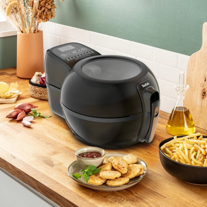 Мультипіч Tefal ActiFry & Grill Genius, 1500Вт, чаша-4л, сенсорне керув., підкл. до смартфону, авто перемішування, пластик, чорно-золотий